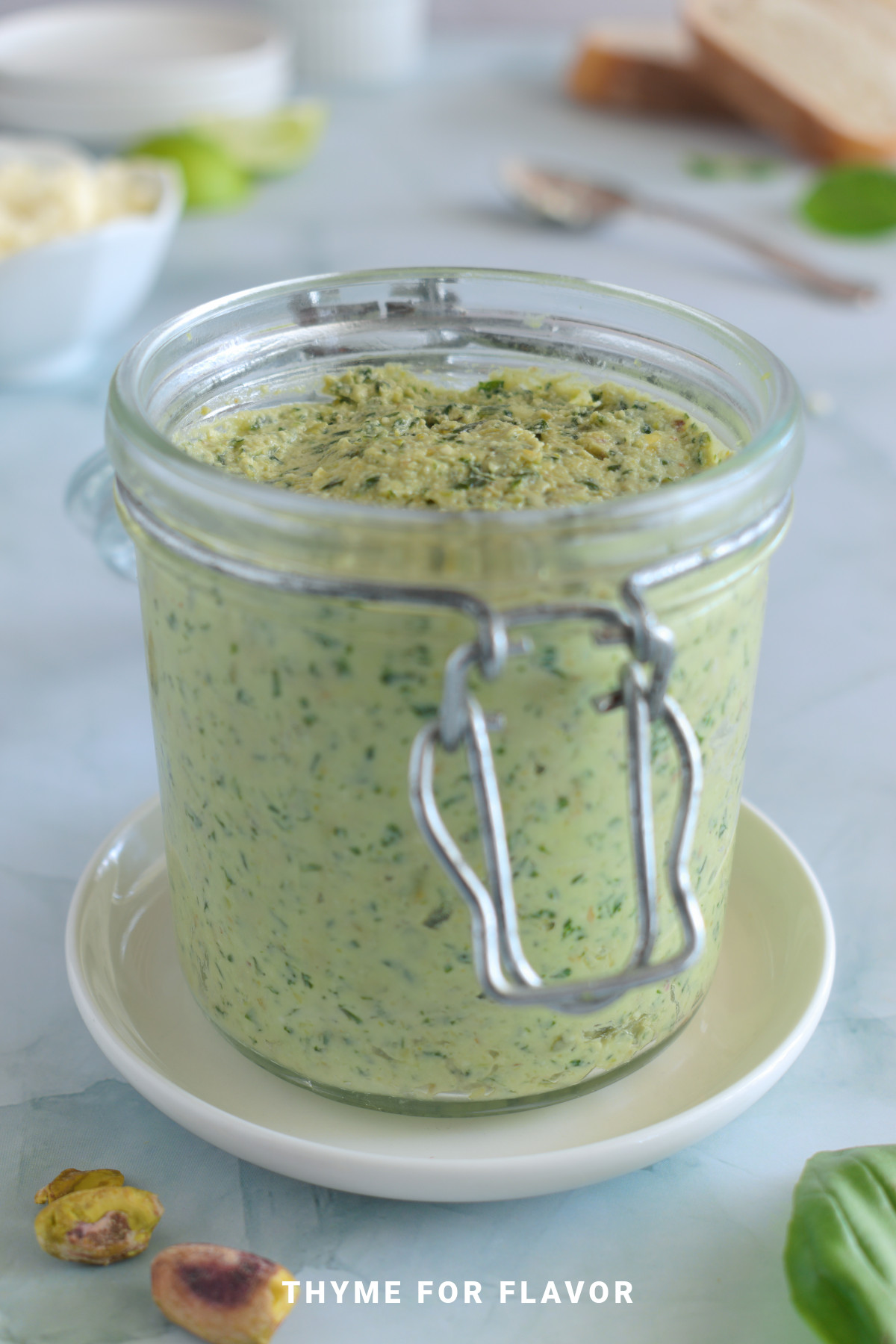 Close up image of ricotta pesto in a glass jar.