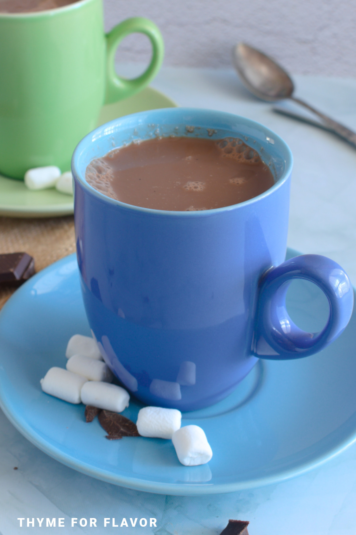Oat milk hot chocolate in a blue mug.