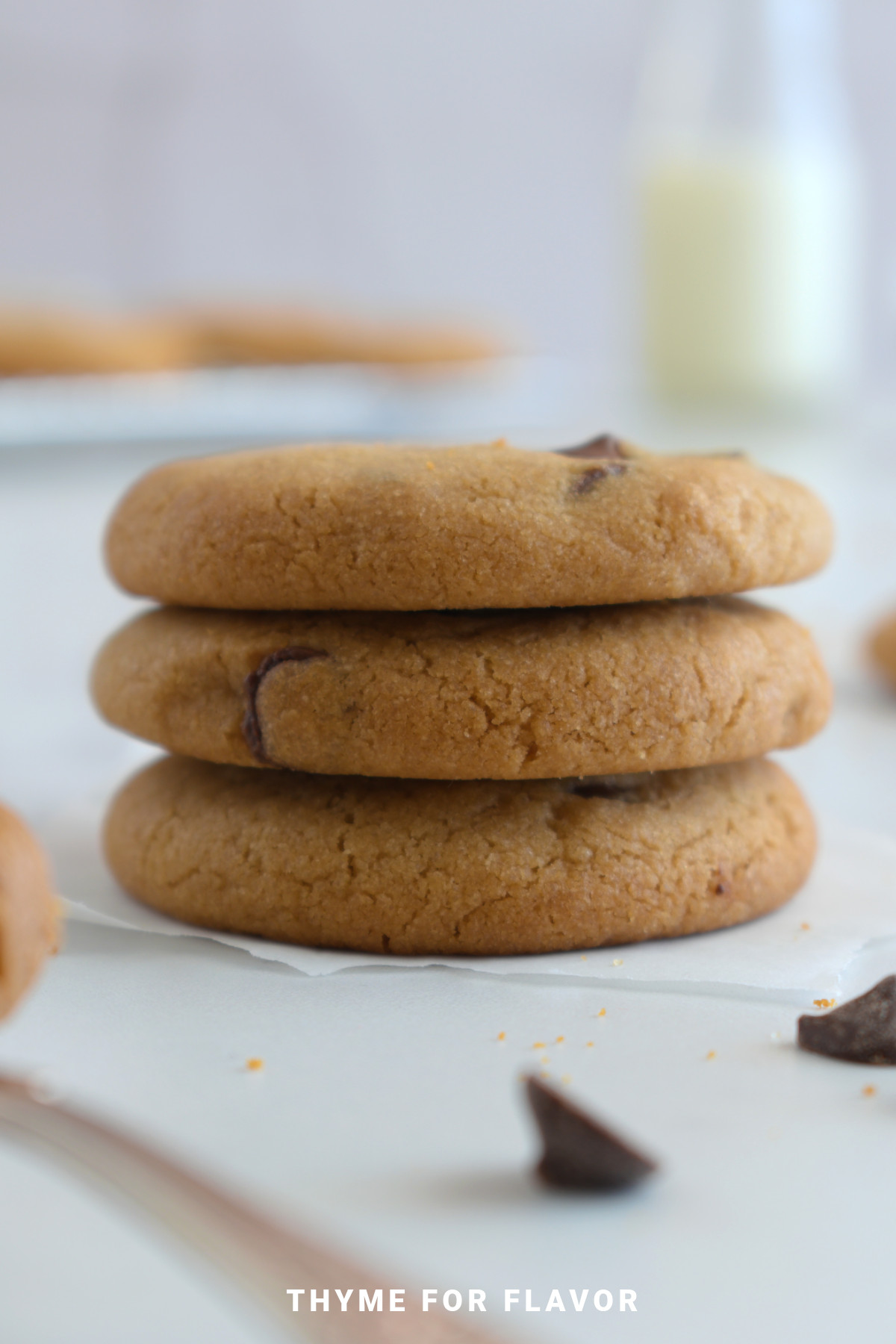 Three biscoff butter cookies stacked on top of each other.