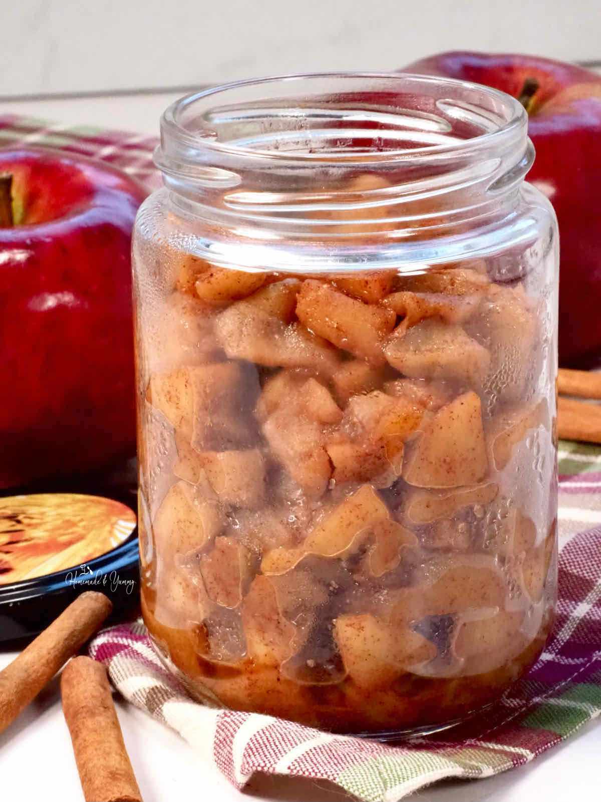 Spiced apple compote in a glass jar.